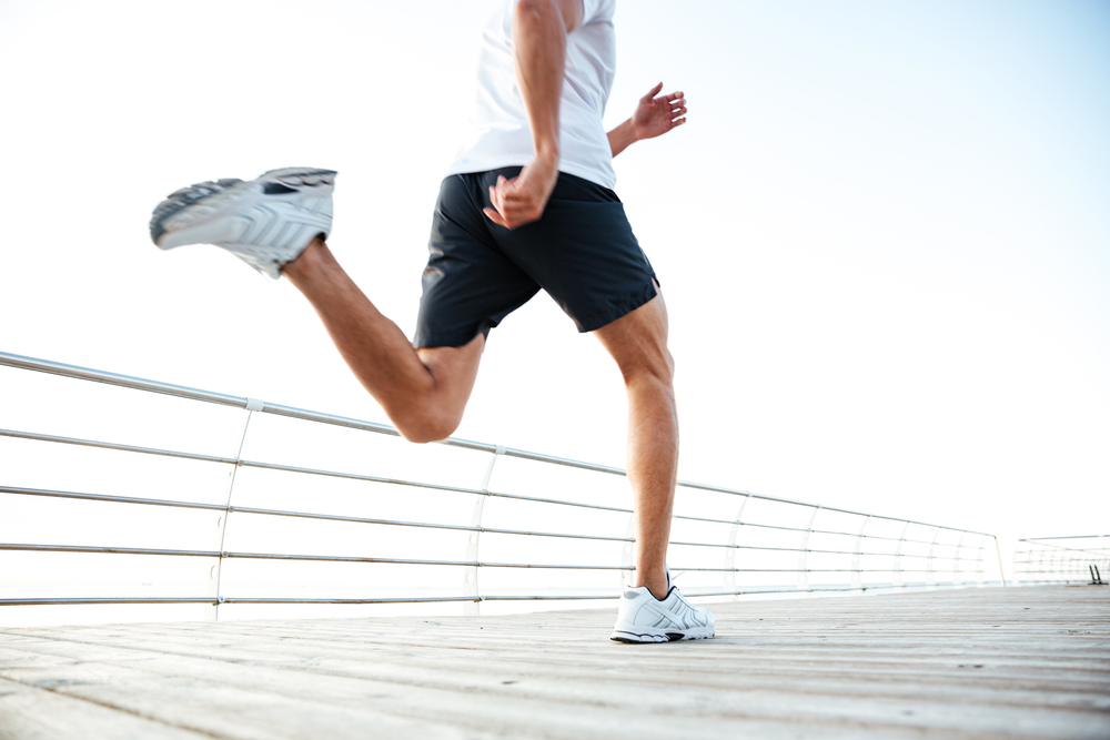Cropped,Image,Of,Man,Athlete,Runner’s,Feet,And,Shoes,Running