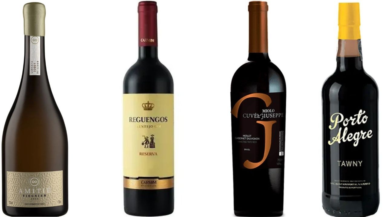 Quatro garrafas de vinho em fundo branco: uma de espumante Amiti&eacute;, uma de vinho tinto Reguengos, uma de vinho tinto Miolo Cuv&eacute;e Giuseppe e uma de vinho do Porto Alegre Tawny